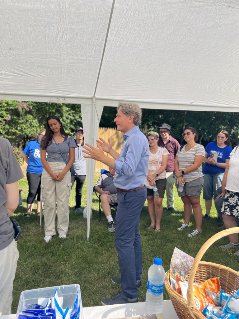 Congressman Tom Malinowski talks with volunteers and voters in Roxbury July 2022